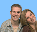 young couple smiling as they are happy with their mortgage advice